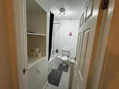a small bathroom with a toilet and a sink at Double bed BW2 Accrington Burnley in Accrington