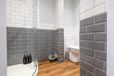 a bathroom with a shower and a toilet at Cosy Home 2 Bedroom House Birkdale in Southport