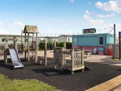 a playground with a slide at Ocean View in Lancaster