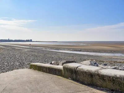 a beach with a rocky shoreline with the ocean at Sand Dune - Uk48699 in Lancaster