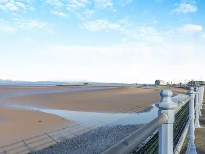 a view of the beach from a fence at Sand Dune - Uk48699 in Lancaster