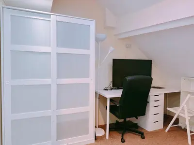 an office with a desk with a computer and a glass door at The Comfy Lofty Studio - R9 in Liverpool