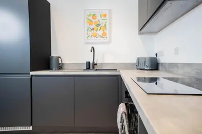 a kitchen with a sink and a counter top at Luxury Apartment - Sleeps 5 - Rose Platinum Properties in Liverpool