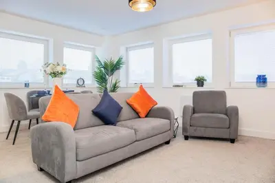 a living room with a couch and two chairs at Luxury Apartment - Sleeps 5 - Rose Platinum Properties in Liverpool