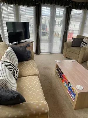 a living room with a couch and a coffee table at Willow summer house in Heysham