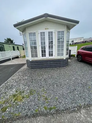 a small building with a car parked in front of it at Willow summer house in Heysham