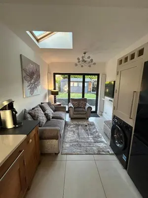 a living room with a couch and a table at The Willows in Whalley