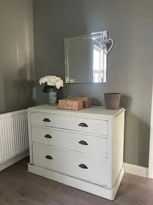 a white dresser with a mirror on top of it at The Old Nursery in Blackburn