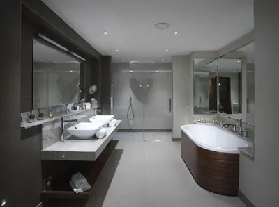 a bathroom with two sinks and a tub and a shower at Northcote in Langho