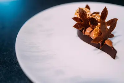 a piece of chocolate on a white plate at Northcote in Langho