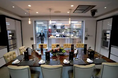 a dining room with a long table and chairs at Northcote in Langho