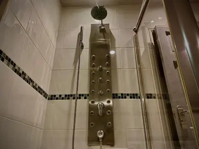 a shower in a bathroom with a shower at Sleeps10-Parking-Garden-HotTub-PetFriendly in Blackpool