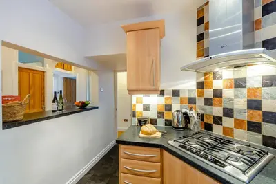 a kitchen with a stove and a counter top at 3 Bed in Lytham St. Annes oc-m30622 in Saint Annes on the Sea