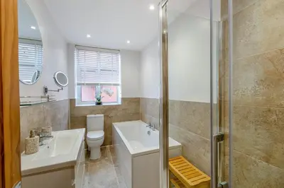 a bathroom with a toilet and a sink and a shower at 3 Bed in Lytham St. Annes oc-m30622 in Saint Annes on the Sea