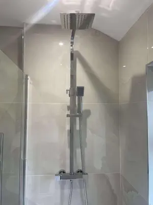a shower in a bathroom with a glass door at The Crescent-Modern Coastal Home in Blackpool