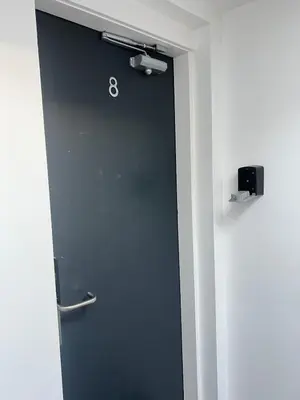 a door with the number eight on it in a room at Castle Street 2 Bedroomed Next to The IVY in Liverpool