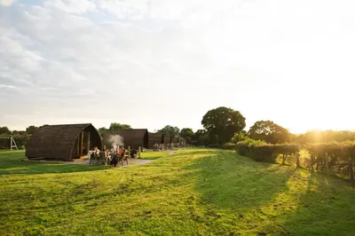 a group of people standing in front of a barn at Ribble Valley by Wigwam Holidays in Langho