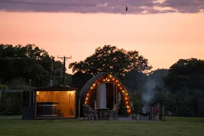 a hobbit house in a field at sunset at Ribble Valley by Wigwam Holidays in Langho