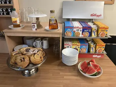 a counter with a table with some food on it at The Norwood Hotel in Blackpool