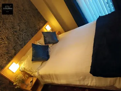 a bedroom with a bed with two pillows on it at The Norwood Hotel in Blackpool
