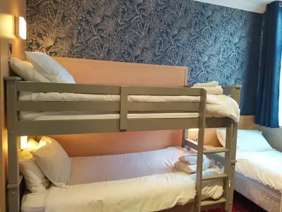 a bunk bed room with two bunk beds in it at The Norwood Hotel in Blackpool