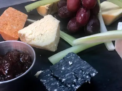 a bunch of different types of cheese and grapes at Briardene in Blackpool