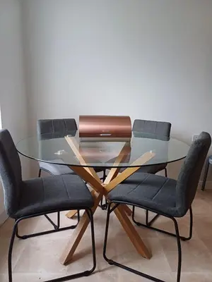 a glass table with two chairs and a glass table with a glass table at Great Home in Liverpool