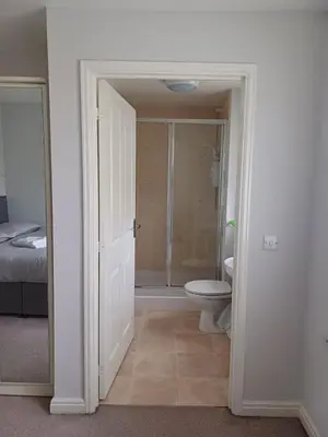 a bathroom with a shower and a toilet in it at Great Home in Liverpool