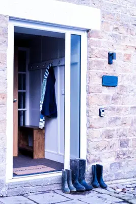 a door of a building with boots in it at Luxury modern canal side cottage for families, couples, contractors and dog friendly in Lancashire sleeps 6 in Preston