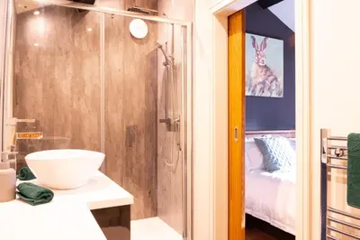 a bathroom with a shower and a sink and a toilet at Luxury modern canal side cottage for families, couples, contractors and dog friendly in Lancashire sleeps 6 in Preston