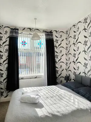 a bedroom with a bed and a window at Delightful Blackpool Home in Blackpool