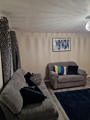 a living room with two couches and a couch at Entire 3 bedroom luxurious house, Wigan , Manchester in Wigan