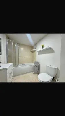 a bathroom with a toilet and a sink and a tub at 2 Bedroom Beachside House Sleeps 4 - Private Patio in Southport