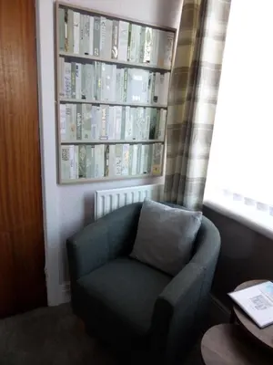 a chair sitting in a room with a window at Nathans in Blackpool