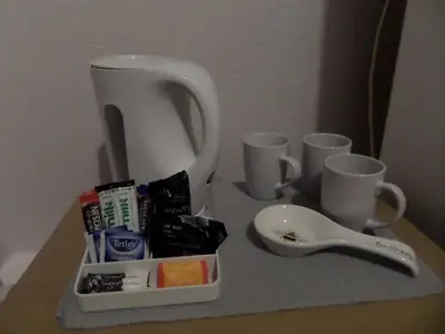 a table with cups and utensils and a blender at Nathans in Blackpool