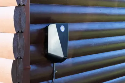 a soap dispenser attached to a wooden wall at Sandmartin Lodge a lakeshore haven at Pine Lake Resort in Carnforth