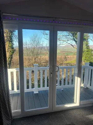 a sliding glass door with a view of a balcony at Getaway in Longridge