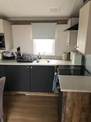 a kitchen with a sink and a counter top at Getaway in Longridge
