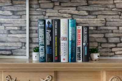 a row of books sitting on top of a shelf at Fairburn House - Air Host & Stay - Contractor Friendly in Liverpool