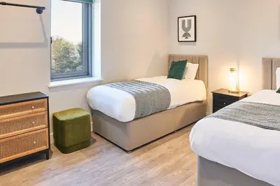a bedroom with two beds and a window at Host & Stay - Mariposa Waterloo in Sefton