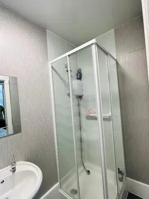 a bathroom with a shower and a sink at Shokal Nest in Blackpool