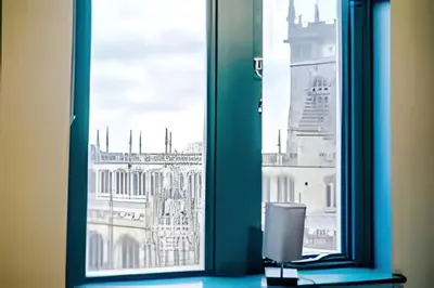 a window with a view of a building at 1 Bedroom Apartment in Wigan Town Centre With Free Parking, by Short Term Digs Short Lets & Serviced Accommodation in Wigan