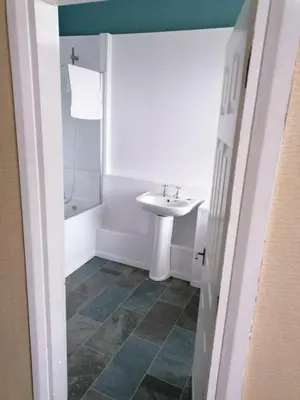 a bathroom with a sink and a shower at Edenfield Lodge in Blackpool