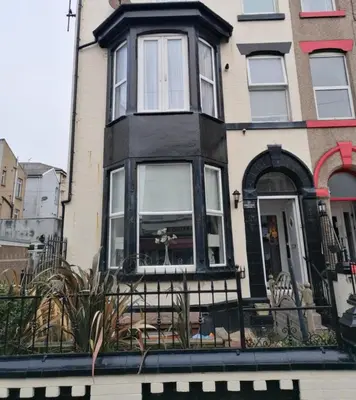 a black and white house with a window at Edenfield Lodge in Blackpool