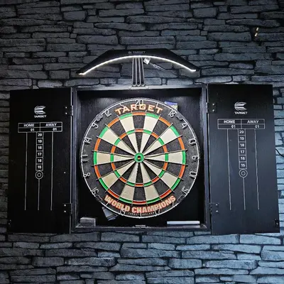 a dart board on a brick wall at 100 Pipers Hotel in Blackpool
