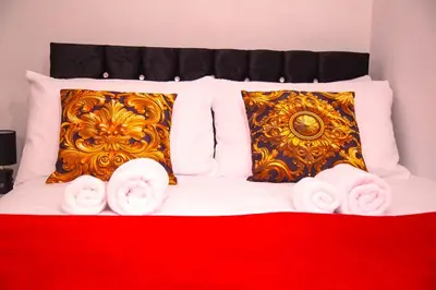 a bed with white towels and pillows on it at Lucky Home 7 - Ideal for Trade & Family - 2 Bedrooms - 2 Beds - Max 4 Guests - Close to BAE, Docks, Lake District, Beaches in Barrow in Furness
