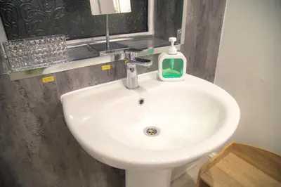 a bathroom sink with a soap dispenser on it at Lucky Home 7 - Ideal for Trade & Family - 2 Bedrooms - 2 Beds - Max 4 Guests - Close to BAE, Docks, Lake District, Beaches in Barrow in Furness