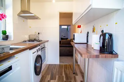 a kitchen with a washer and dryer on a counter at Lucky Home 15 - Ideal for Trade & Family - 2 Bedrooms - 2 Beds - Max 4 Guests - Close to BAE, Docks, Lake District, Beaches in Barrow in Furness