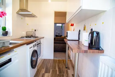 a kitchen with a washer and dryer on a counter at Lucky Home 15 - Ideal for Trade & Family - 2 Bedrooms - 2 Beds - Max 4 Guests - Close to BAE, Docks, Lake District, Beaches in Barrow in Furness