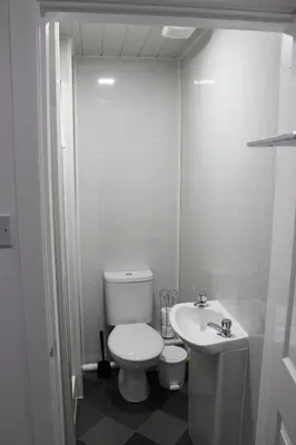 a bathroom with a white toilet and a sink at The Moray House in Blackpool